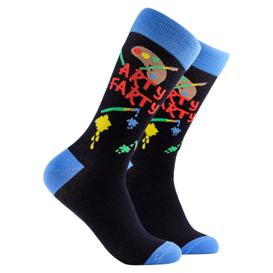 Art Socks - Arty Farty. A pair of socks depicting an artist pallet and paint splashes. Dark blue legs, light blue cuff, heel and toe. 