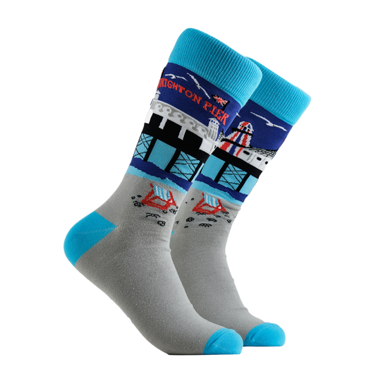 Brighton Pier Socks - Beside The Seaside. A pair of socks depicting Brighton Pier. Grey legs, light blue cuff, heel and toe.