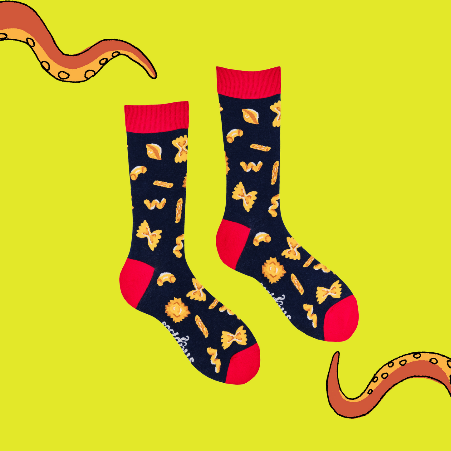 
                  
                    A pair of socks depicting different pasta shapes. Dark blue legs, red cuff, heel and toe.
                  
                