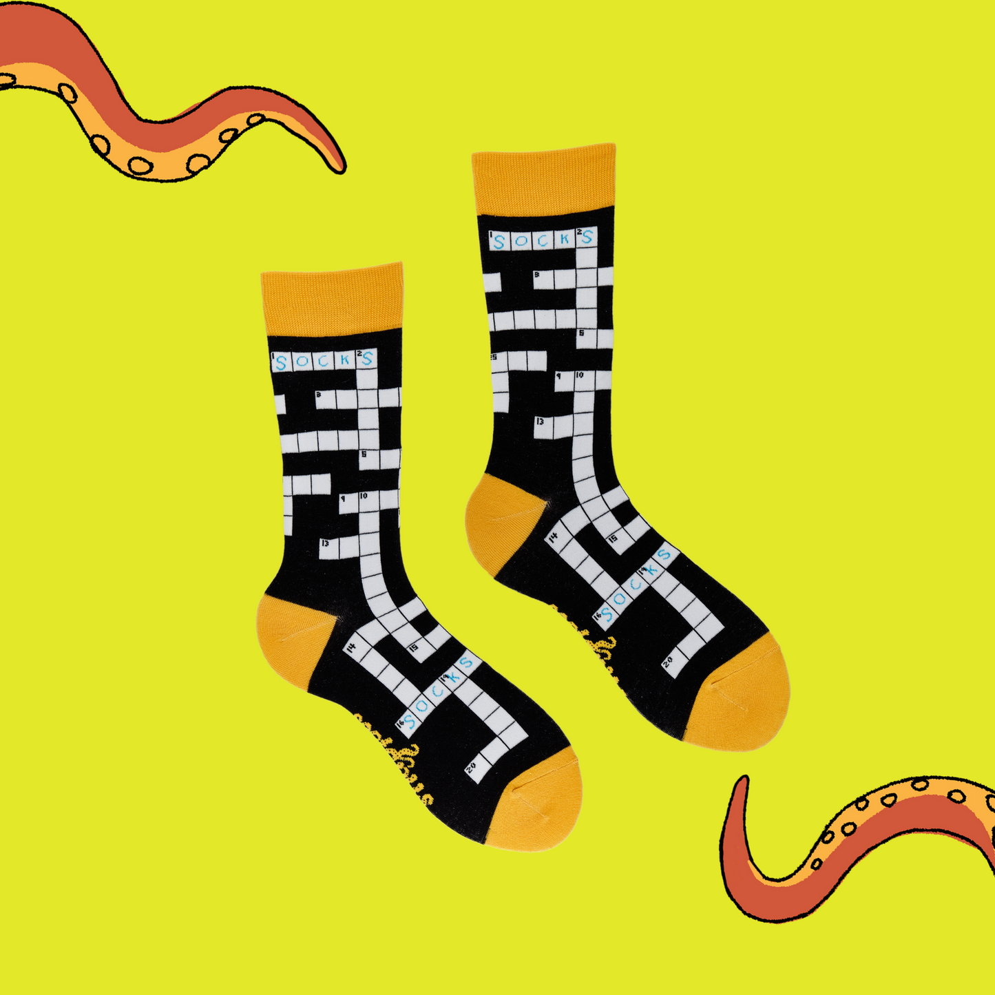 
                  
                    A pair of socks depicting Crosswords. Black legs, yellow cuff, heel and toe.
                  
                