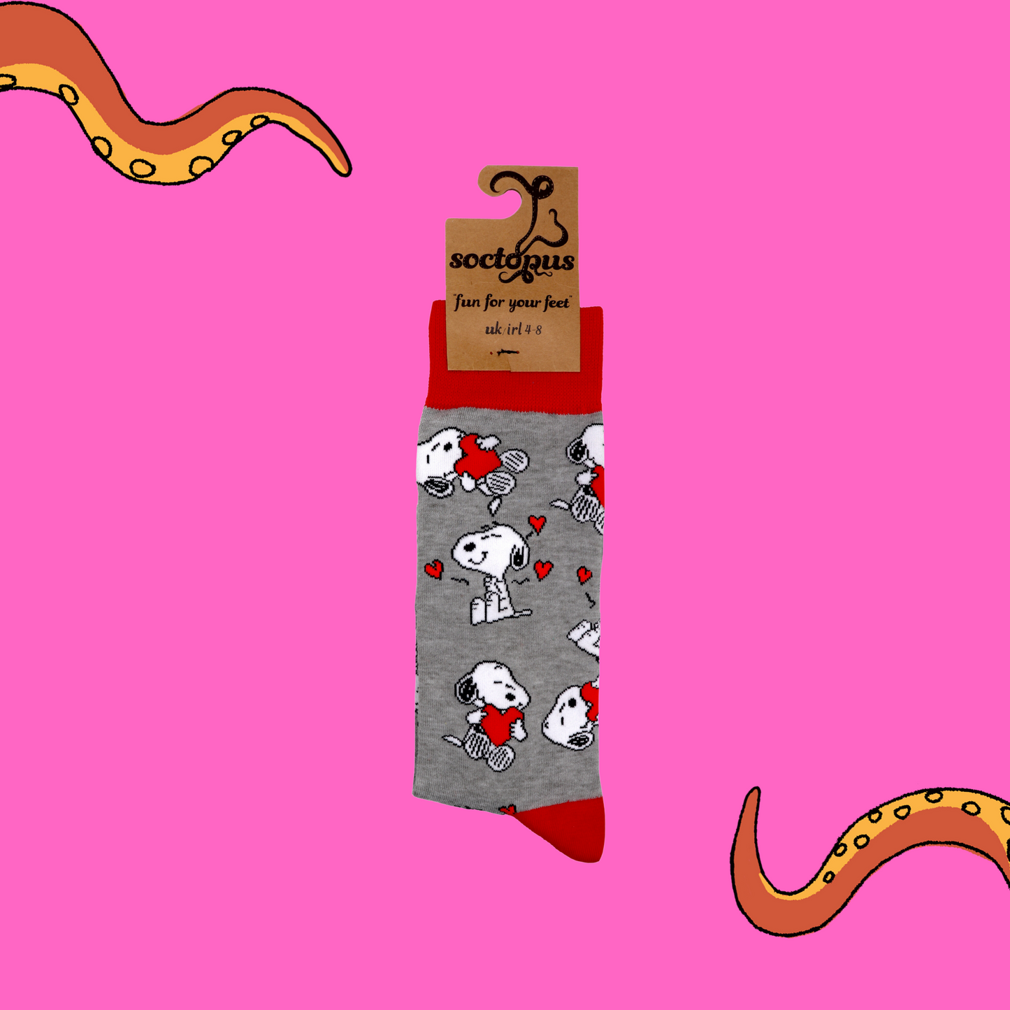 
                  
                    A pair of socks depicting Snoopy and love hearts. Grey legs, red cuff, heel and toe. In Soctopus Packaging.
                  
                