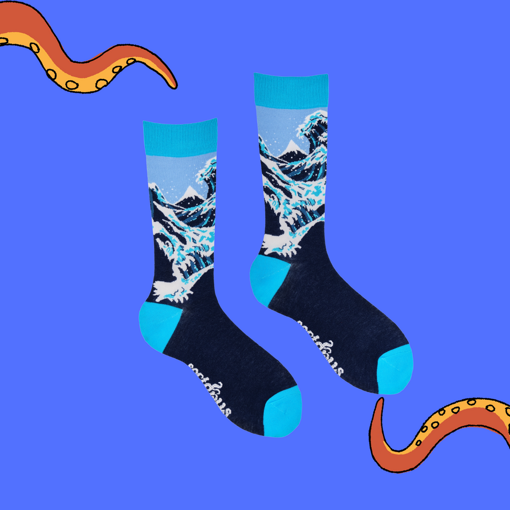 
                  
                    A pair of socks depicting The Great Wave off Kanagawa. Dark blue legs, bright blue cuff, heel and toe.
                  
                