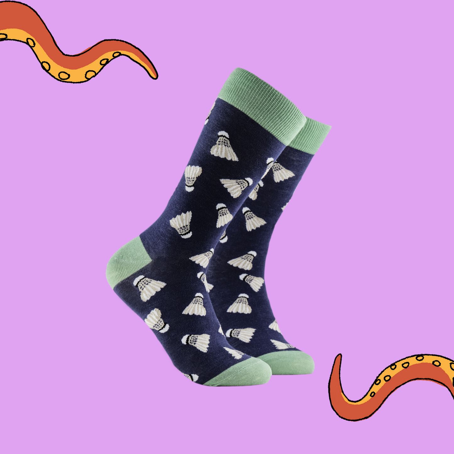 A pair of socks depicting shuttlecocks. Dark blue legs, green cuff, heel and toe.