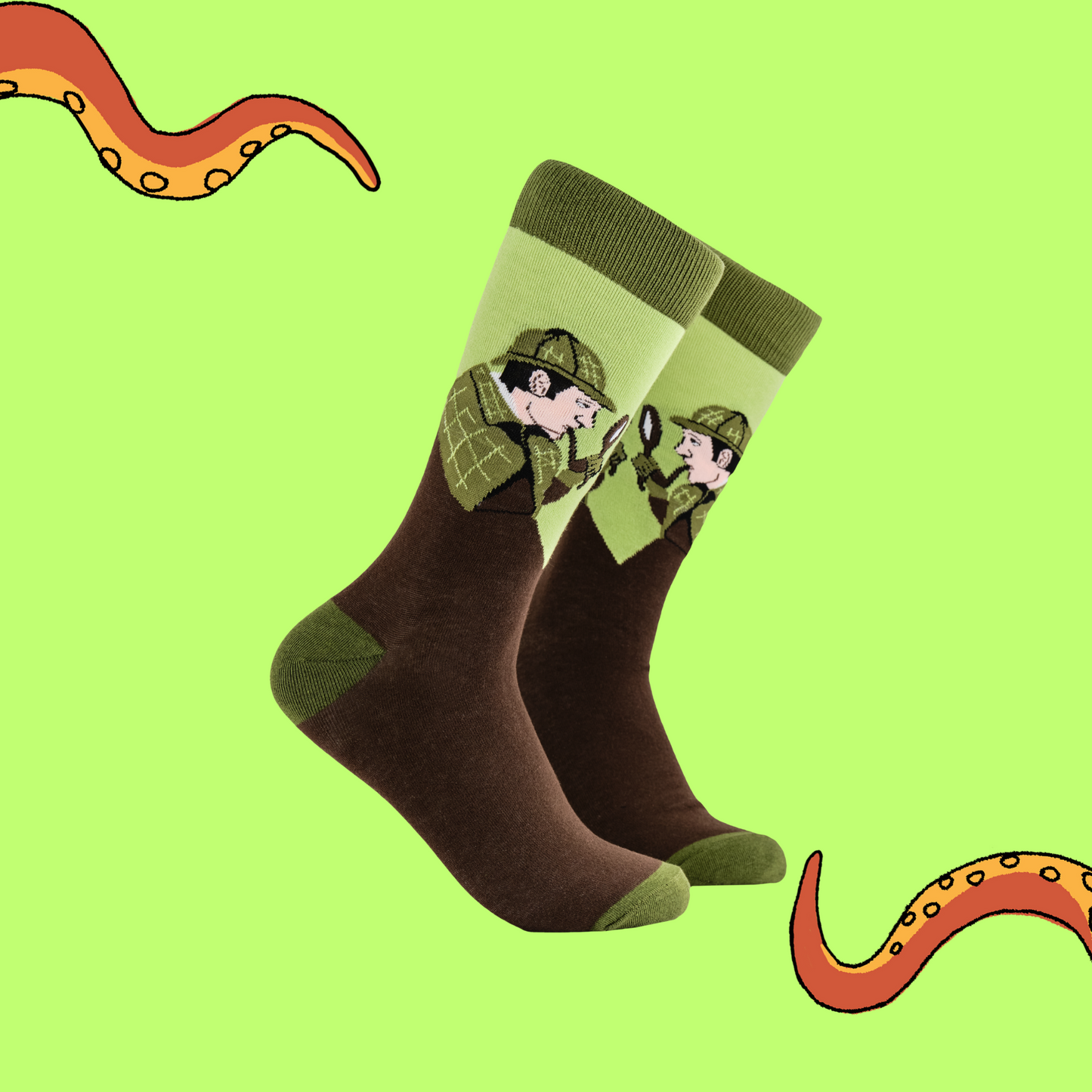  A pair of socks depicting Sherlock Holmes with hat and pipe. Brown legs, green cuff, heel and toe.