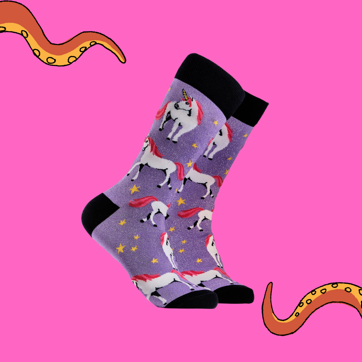 
                  
                    A pair of socks depicting unicorns. Glittery purple legs, black cuff, heel and toe.
                  
                