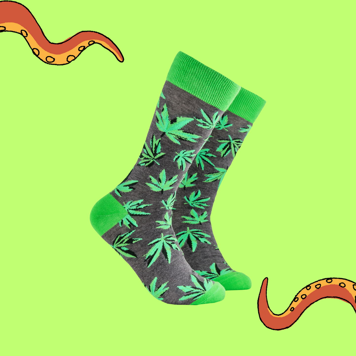 A pair of socks depicting cannabis leaves. Grey legs, bright cuff, heel and toe.