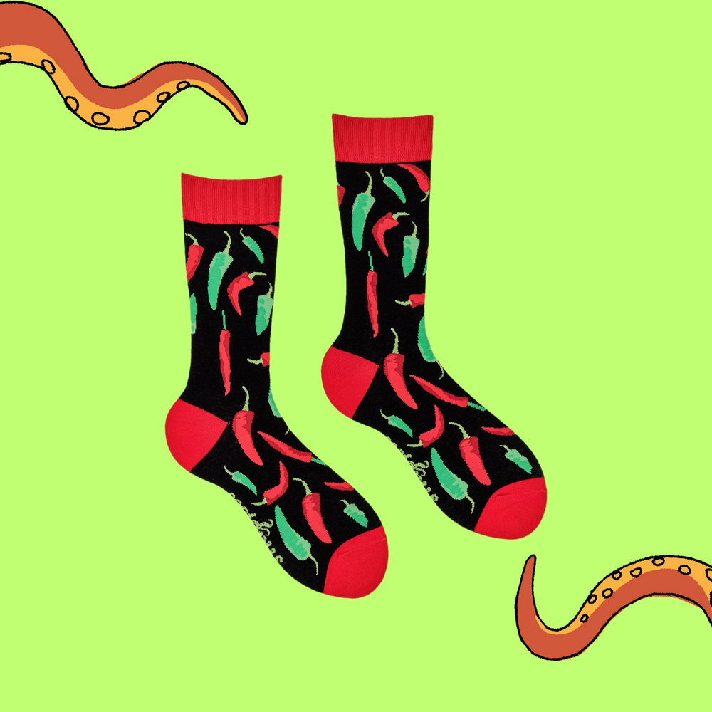 
                  
                    A pair of socks depicting red and green chilli peppers.. Black legs, red cuff, heel and toe.
                  
                