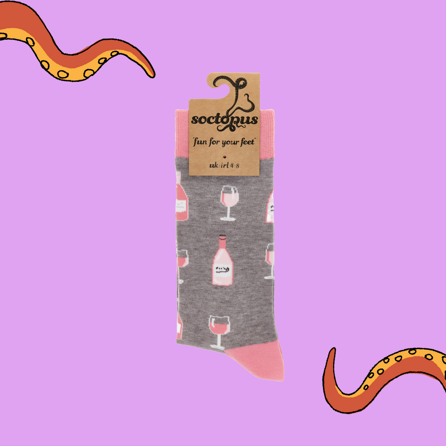 
                  
                    A pair of socks depicting Rose wine bottles and glasses. Grey legs, pink cuff, heel and toe. In Soctopus Packaging. 
                  
                