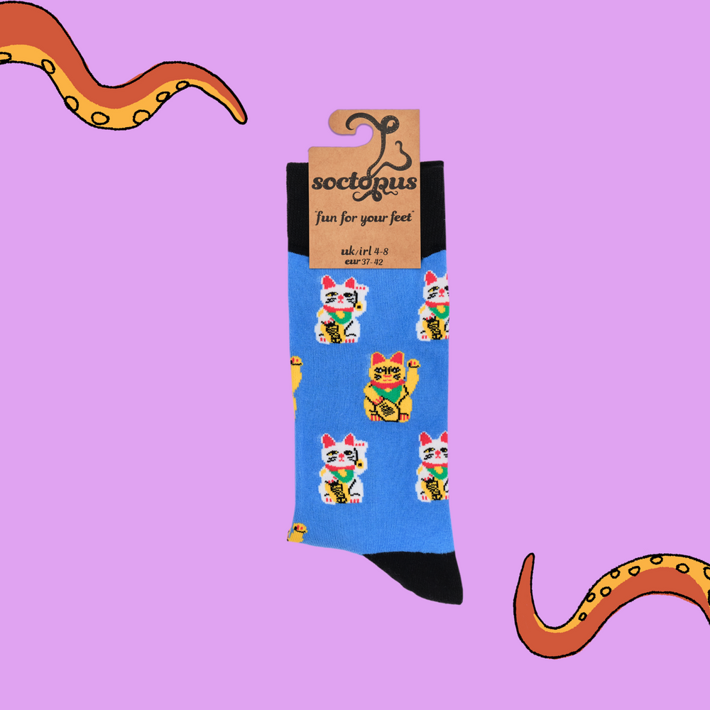 
                  
                    A pair of socks depicting lucky cats. Blue legs, black cuff, heel and toe. In Soctopus Packaging.
                  
                