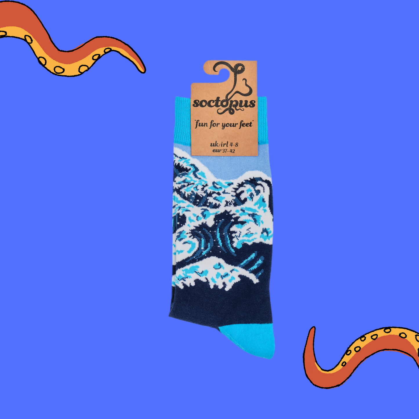 
                  
                    A pair of socks depicting The Great Wave off Kanagawa. Dark blue legs, bright blue cuff, heel and toe. In Soctopus Packaging.
                  
                