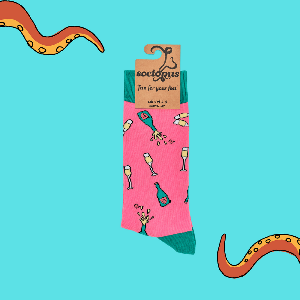 
                  
                    A pair of socks depicting champagne bottles and glasses. Pink legs, turquoise cuff, heel and toe. In Soctopus Packaging.
                  
                