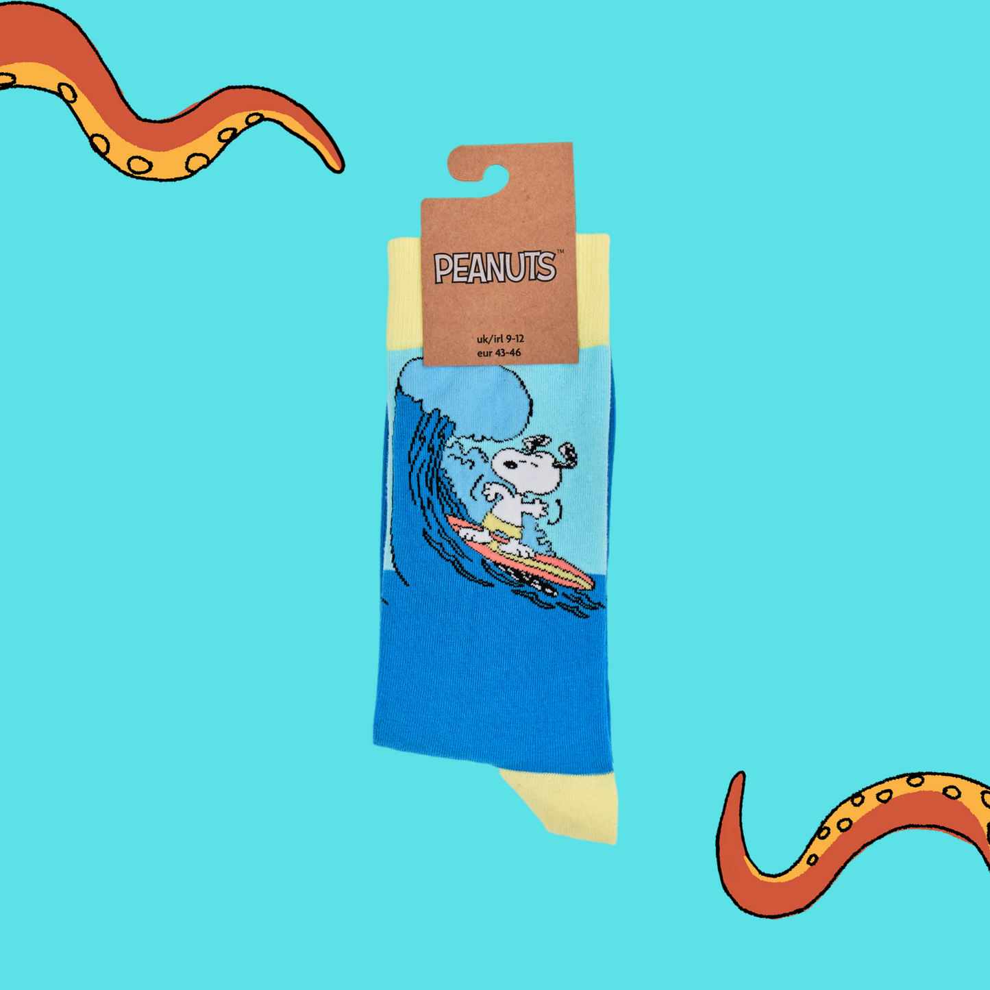 
                  
                    A pair of socks depicting snoopy catching some waves. Blue legs, yellow cuff, heel and toe. In Soctopus Packaging.
                  
                