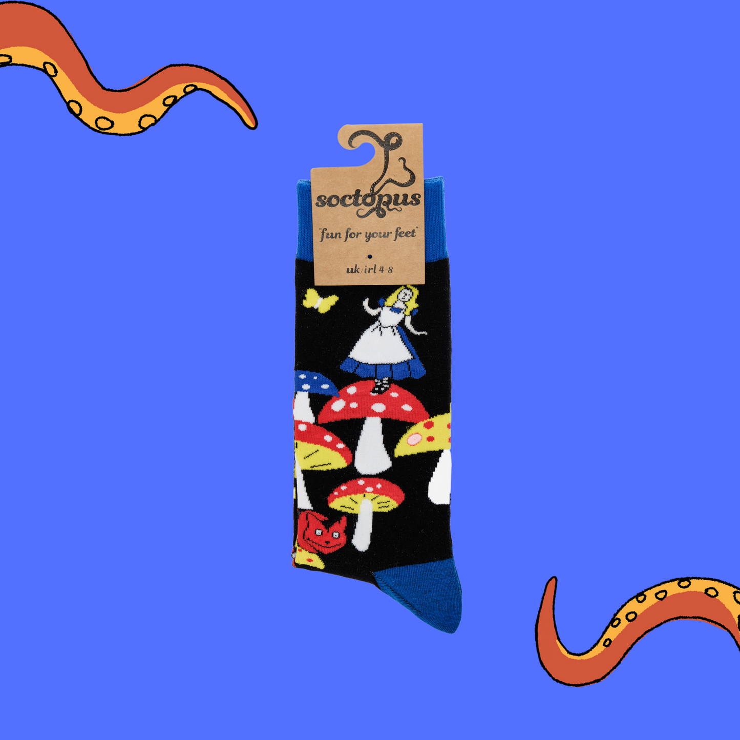
                  
                    A pair of socks depicting Alice in wonderland and toadstools. Black legs, royal blue cuff, heel and toe. In Soctopus Packaging.
                  
                