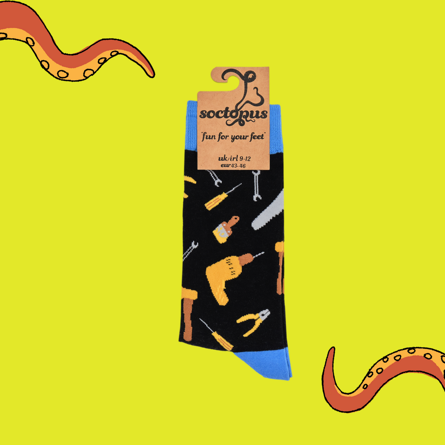 
                  
                    A pair of socks depicting DIY tools. Black legs, blue cuff, heel and toe. In Soctopus Packaging.
                  
                