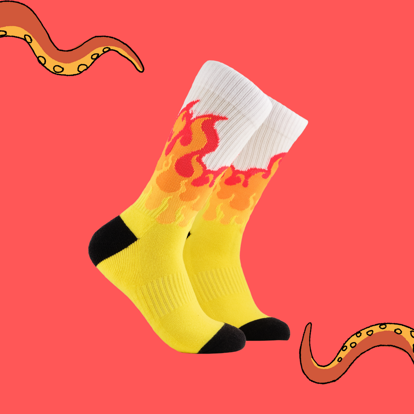 A pair of socks depicting rising flames. Yellow legs, white cuff, black heel and toe.