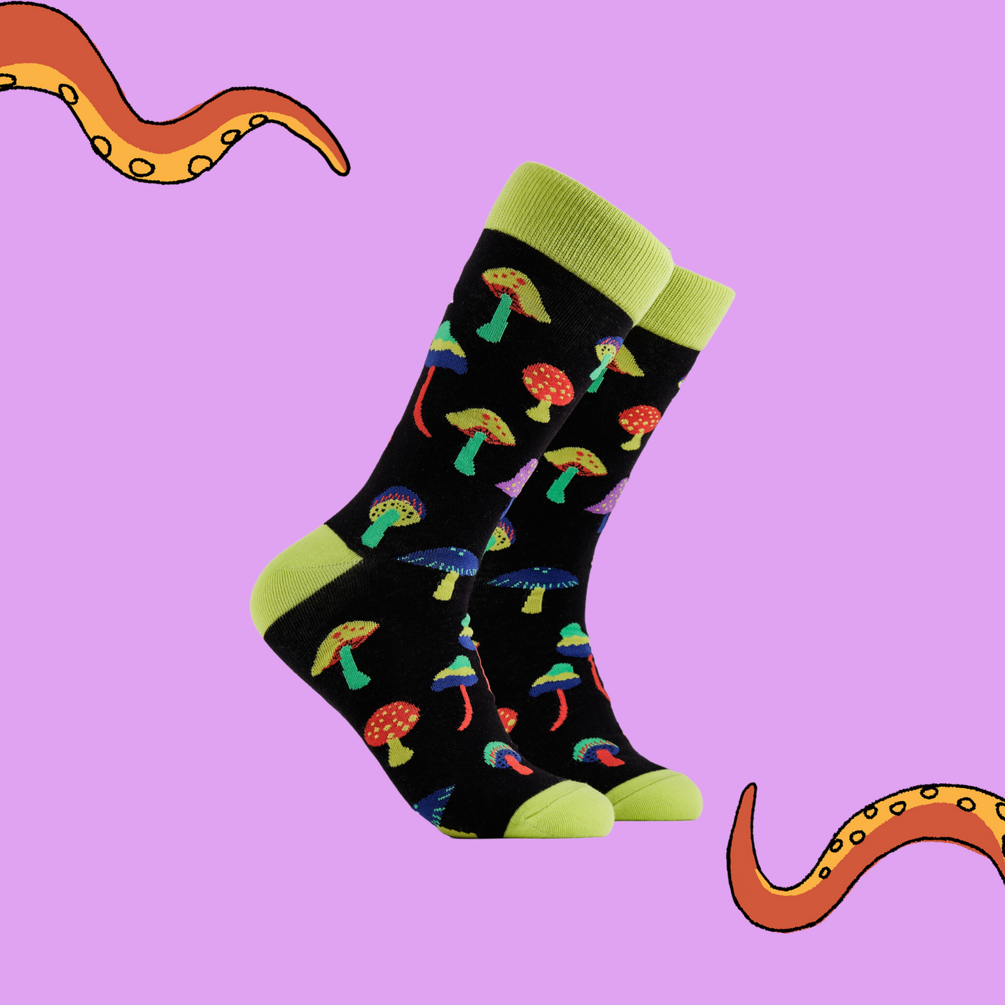A pair of socks depicting magic mushrooms. Black legs, bright yellow cuff, heel and toe.