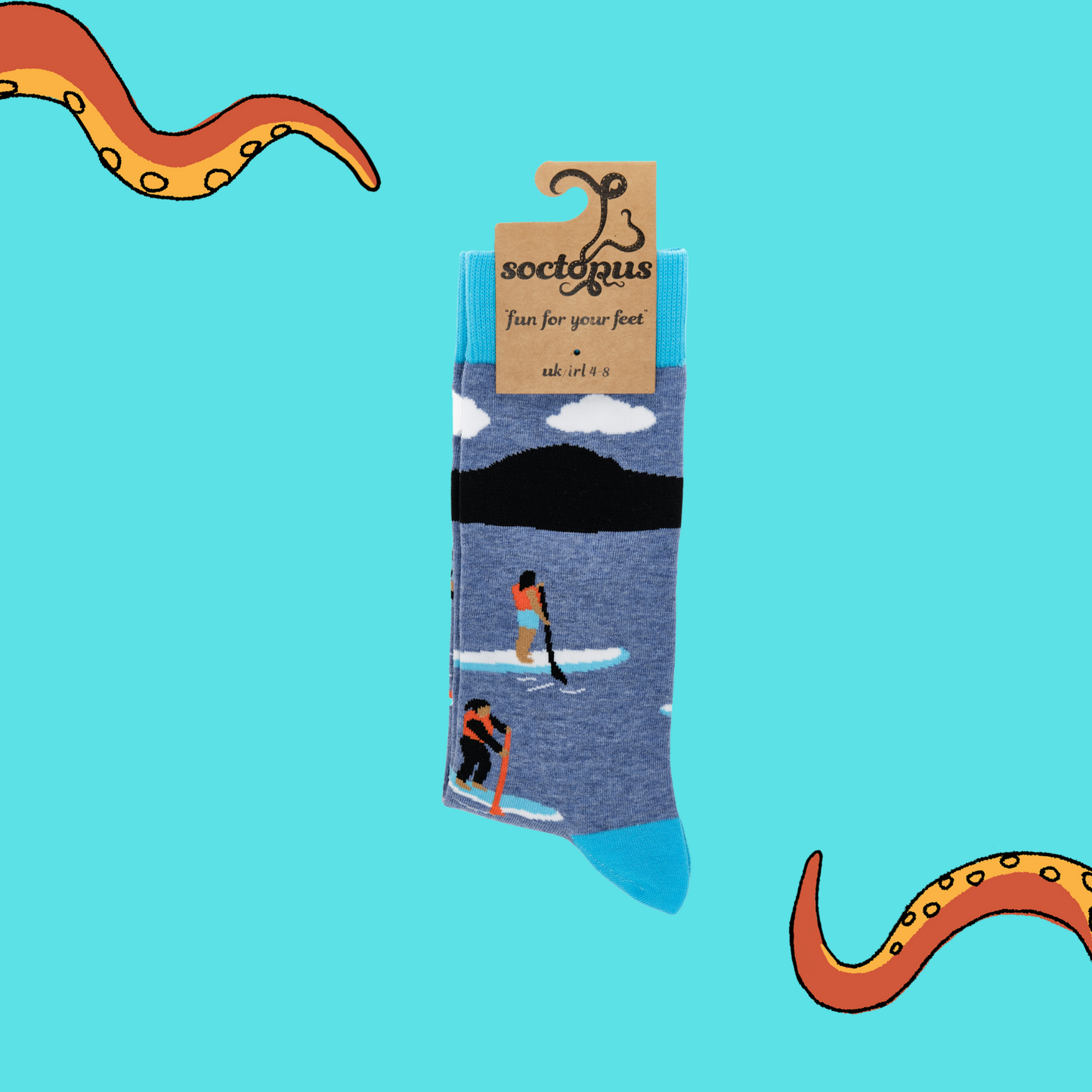 
                  
                    A pair of socks depicting paddle boarding. Blue legs, bright blue cuff, heel and toe. In Soctopus Packaging.
                  
                