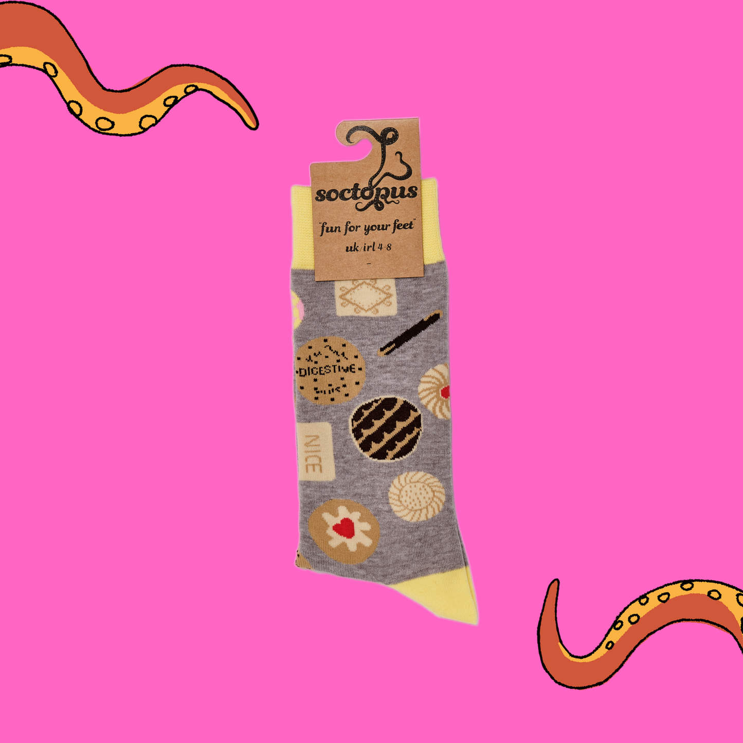 
                  
                    A pair of socks depicting retro and classic British biscuits. Grey legs, yellow cuff, heel and toe. In Soctopus Packaging.
                  
                