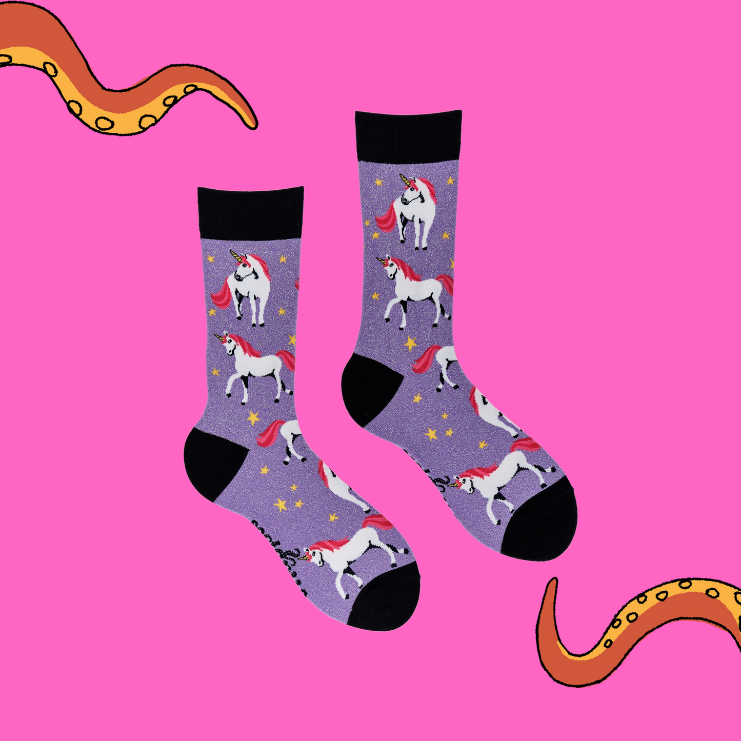 
                  
                    A pair of socks depicting unicorns. Glittery purple legs, black cuff, heel and toe.
                  
                