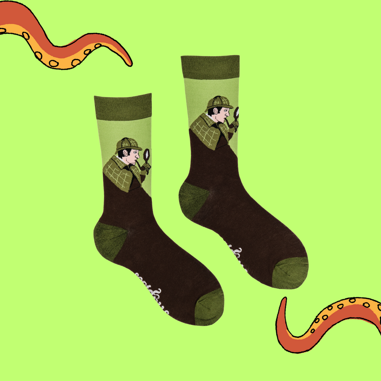 
                  
                     A pair of socks depicting Sherlock Holmes with hat and pipe. Brown legs, green cuff, heel and toe.
                  
                
