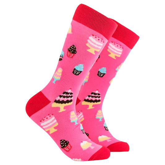 Cake Lover Socks. A pair of socks depicting cakes. Pink legs, red cuff, heel and toe.