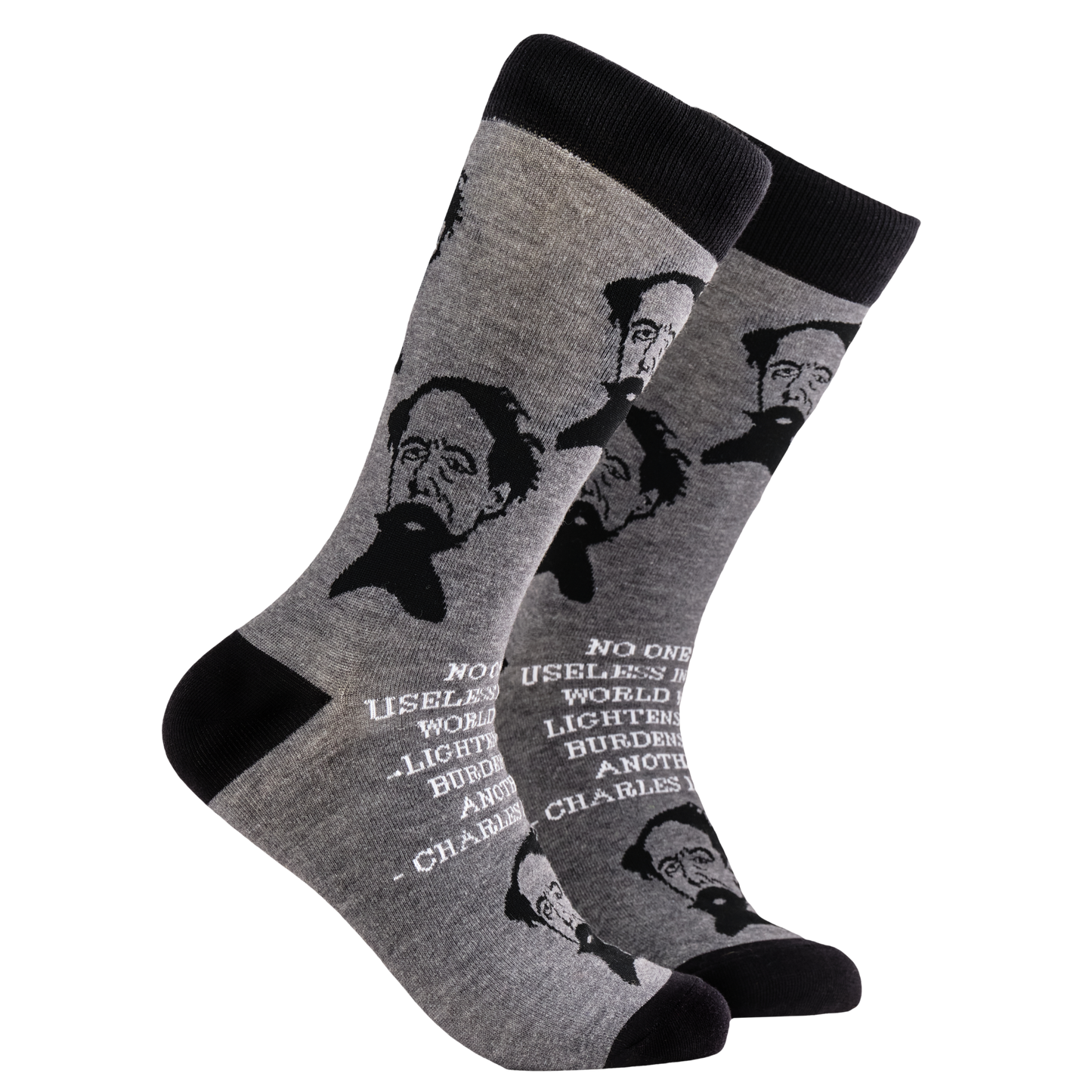 Charles Dickens Socks. A pair of socks depicting Charles Dickens and a quote. Grey legs, black cuff, heel and toe.