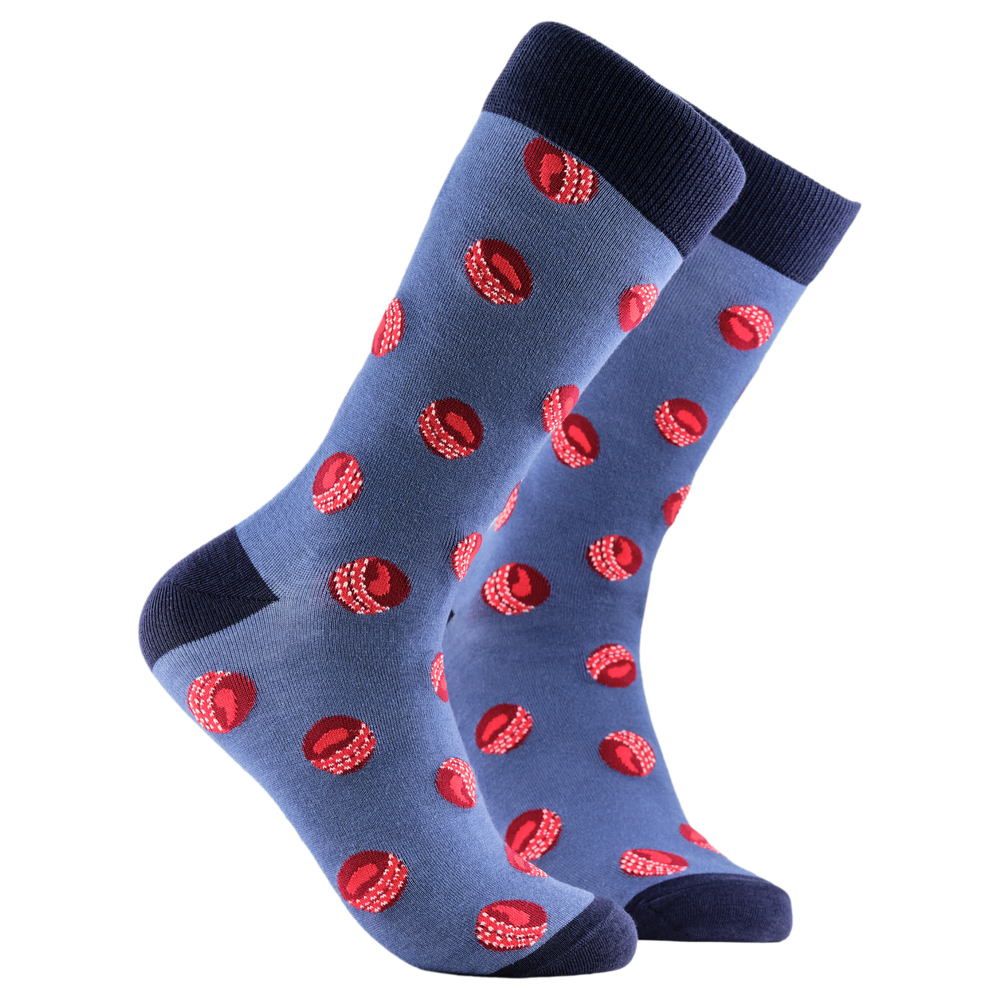 Cricket Balls Bamboo Socks. A pair of socks with a cricket ball pattern. Blue legs, dark blue cuff, heel and toe.