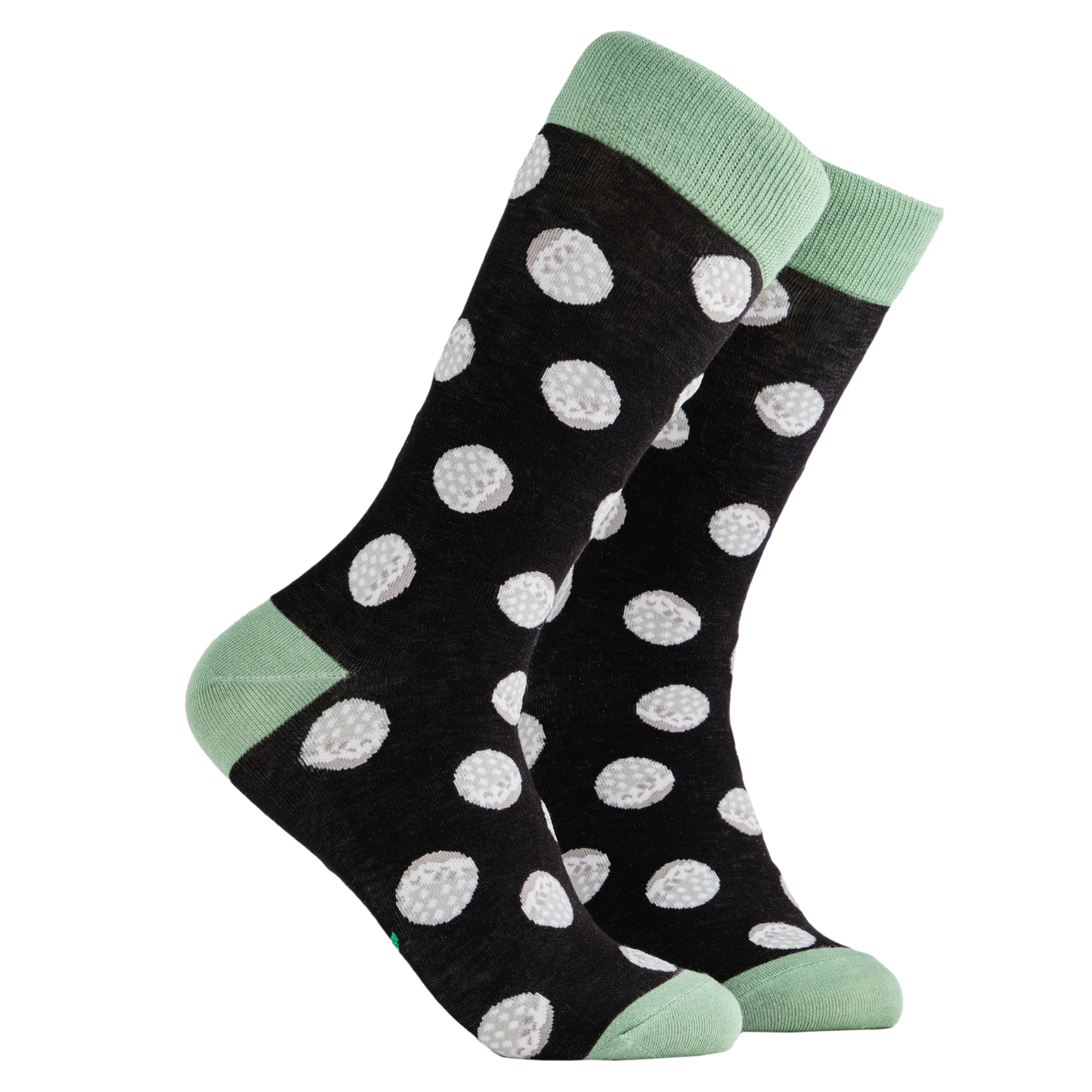 Golf Balls Bamboo Socks. A pair of socks depicting golf balls. Black legs, light green cuff, heel and toe.