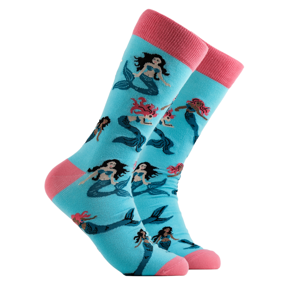Mermaid Socks - Mer-Mazing. A pair of socks depicting mermaids swimming. Light blue legs, pink cuff, heel and toe.