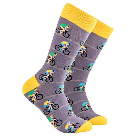 Cycling Socks - Peleton. A pair of socks depicting racing cycles. Grey legs, yellow cuff, heel and toe.