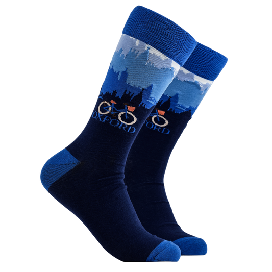 Oxford Socks - SOXFORD. A pair of socks depicting the Oxford skyline and a traditional bicycle. Blue legs, blue cuff, heel and toe.