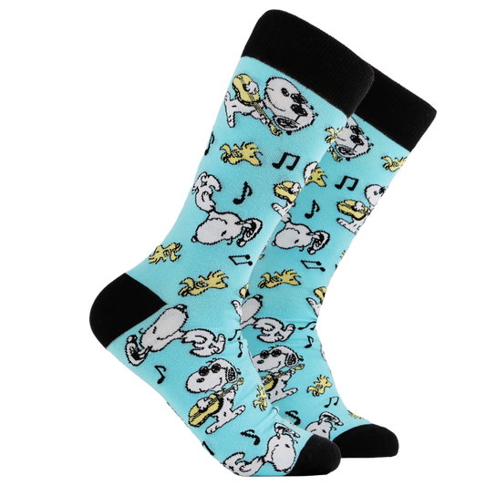 Peanuts Socks - Snoopy Jammin'. A pair of socks depicting snoopy and woodstock jamming. Turquoise legs, black cuff, heel and toe. 