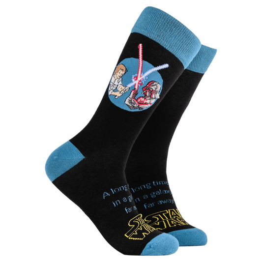 Star Wars Socks - Star Wars. A pair of socks depicting Luke Sywalker and Darth Vader dueling with Lightsabers and featuring the famous scrolling titles. Black legs, blue cuff, heel and toe.