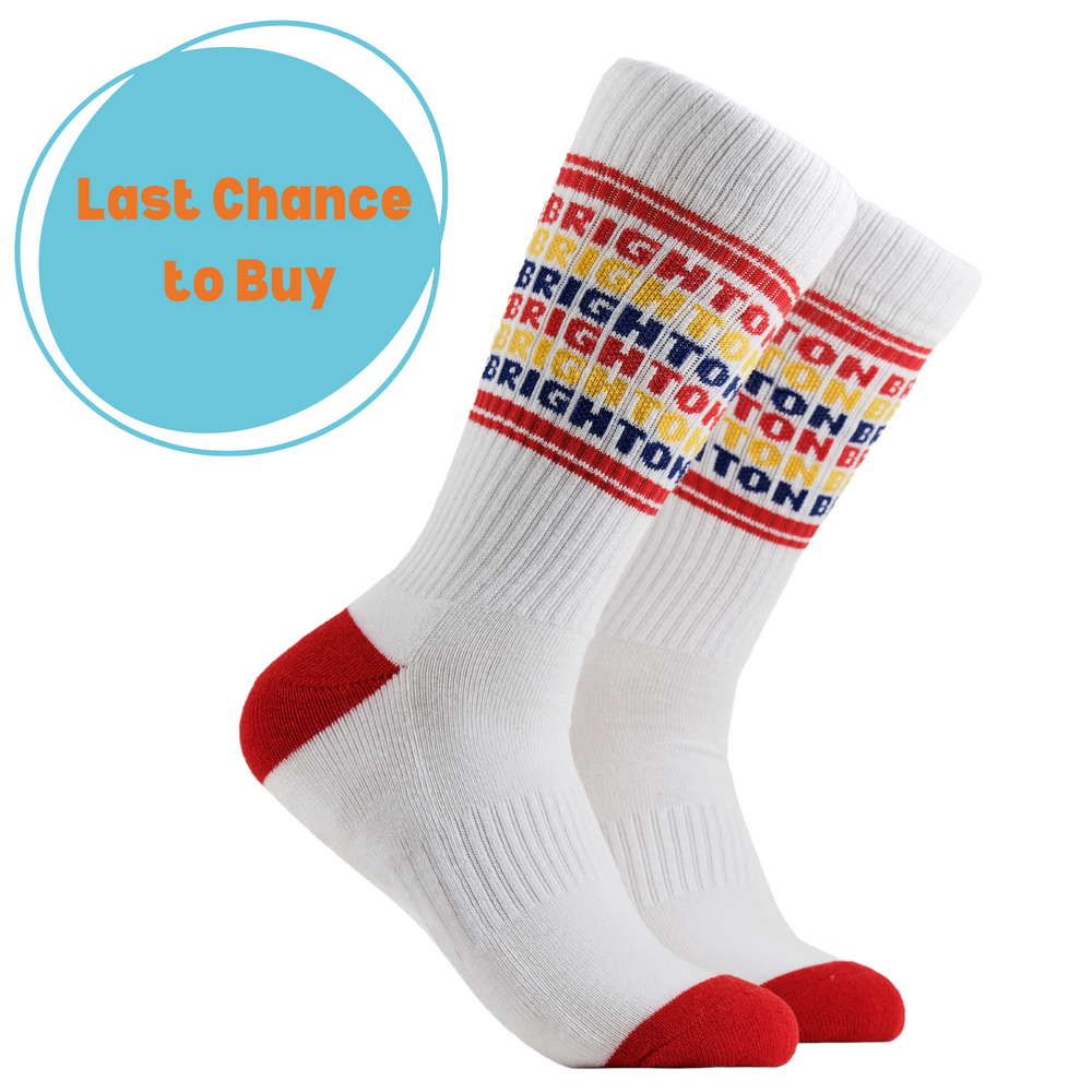 Brighton Athletic Socks. Sports style socks with Brighton text in rainbow colours. White legs, red cuff, heel and toe.