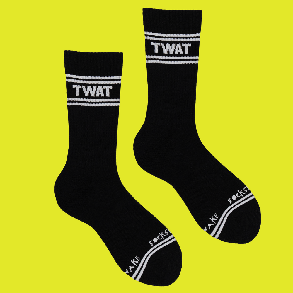 A black pair of athletic socks with white trim on the ankles and toes. A euphemism for the female genitals on the ankle.