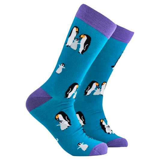 Penguin Socks - We Are Family. A pair of socks depicting a penguin family. Blue legs, purple cuff, heel and toe.