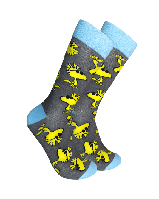 Peanuts Socks - Woodstock. A pair of socks depicting the cool dude Woodstock. Grey legs, blue cuff, heel and toe.