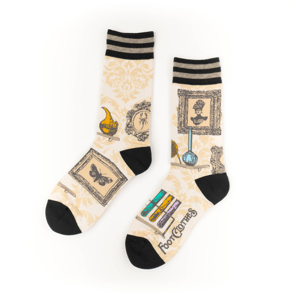 
                      
                        A pair of socks featuring antique curiosities. Cream legs, black heel, toe and cuff. 
                      
                    