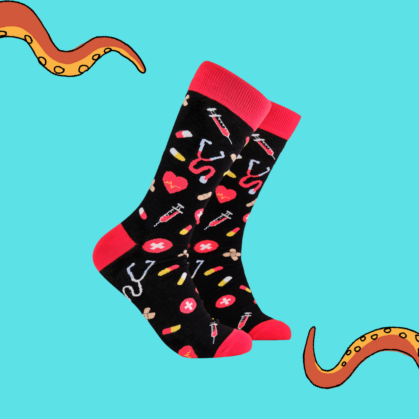 
                  
                    A pair of socks depicting medical equipment and symbols. Black legs, red cuff, heel and toe.
                  
                