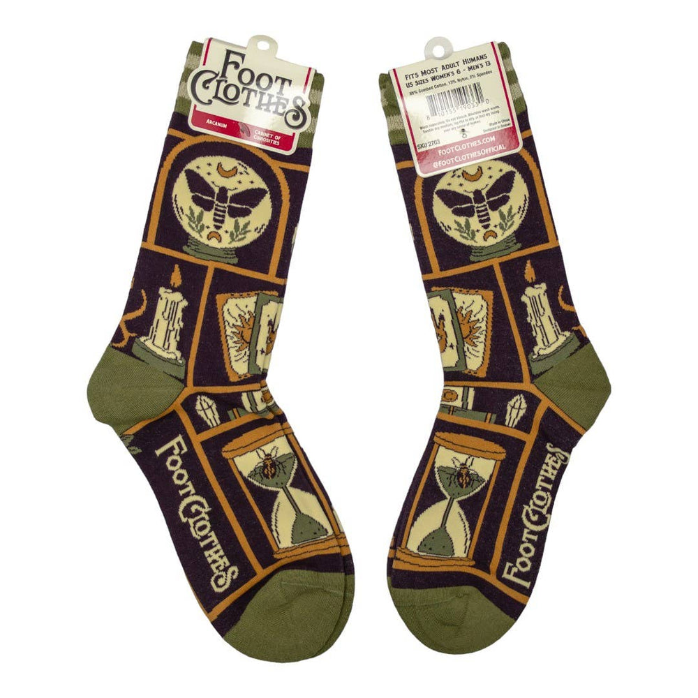 
                      
                        A pair of socks depicting a collection of odd objects. Brown legs, green, heel, toe and cuff. 
                      
                    