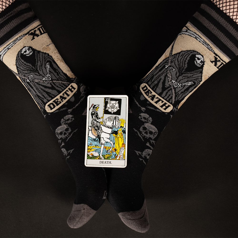 
                      
                        A pair of socks depicting the death tarot card. Grey toe, heel and cuff. 
                      
                    