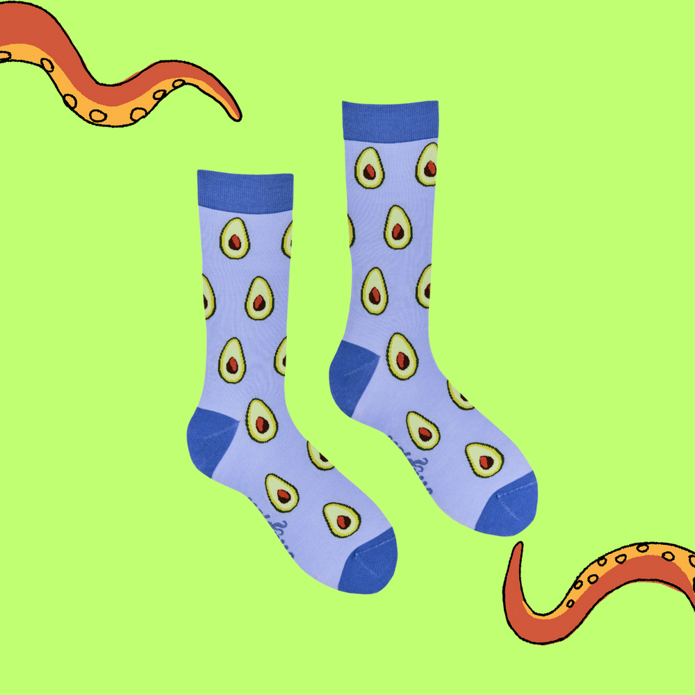 
                  
                    A pair of socks depicting Avocados. Purple legs, blue cuff, heel and toe.
                  
                