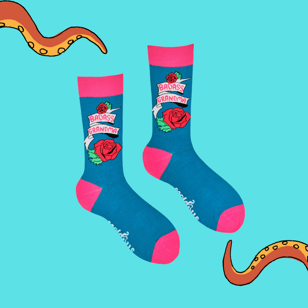 
                      
                        A pair of socks depicting roses and the phrase Baddass Grandma. Blue legs, pink cuff, heel and toe.
                      
                    