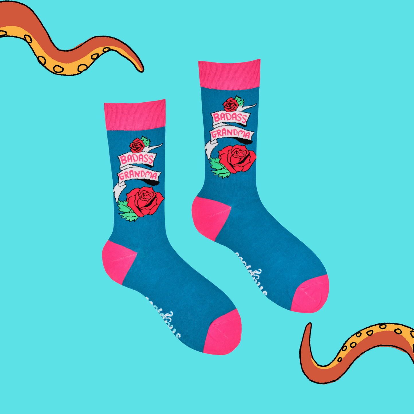 
                  
                    A pair of socks depicting roses and the phrase Baddass Grandma. Blue legs, pink cuff, heel and toe.
                  
                