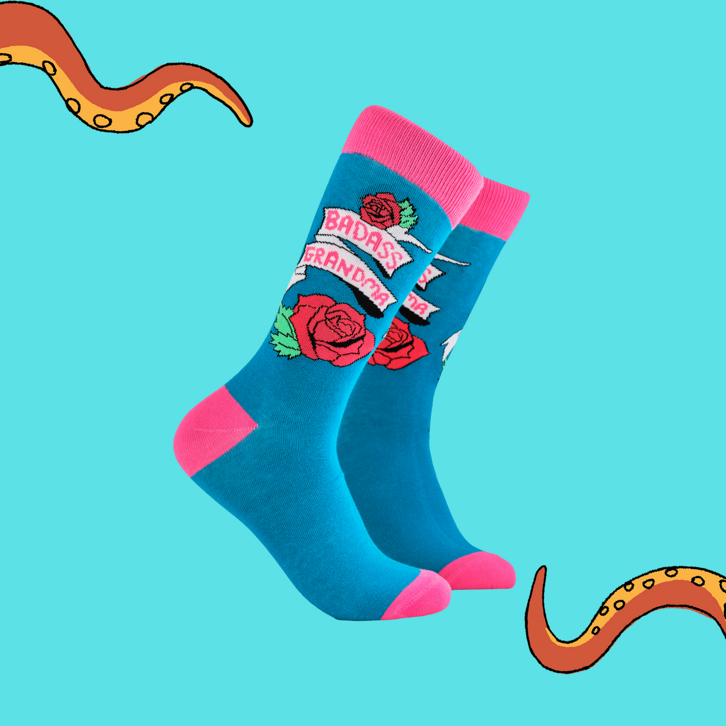 
                  
                    A pair of socks depicting roses and the phrase Baddass Grandma. Blue legs, pink cuff, heel and toe.
                  
                