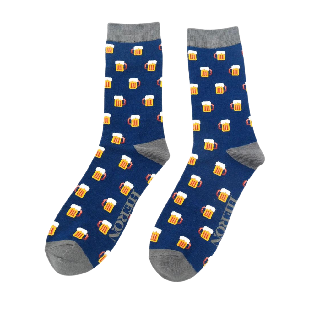 A pair of socks depicting pints of frothing beer. Royal blue legs, dark grey toe, cuff and heel.