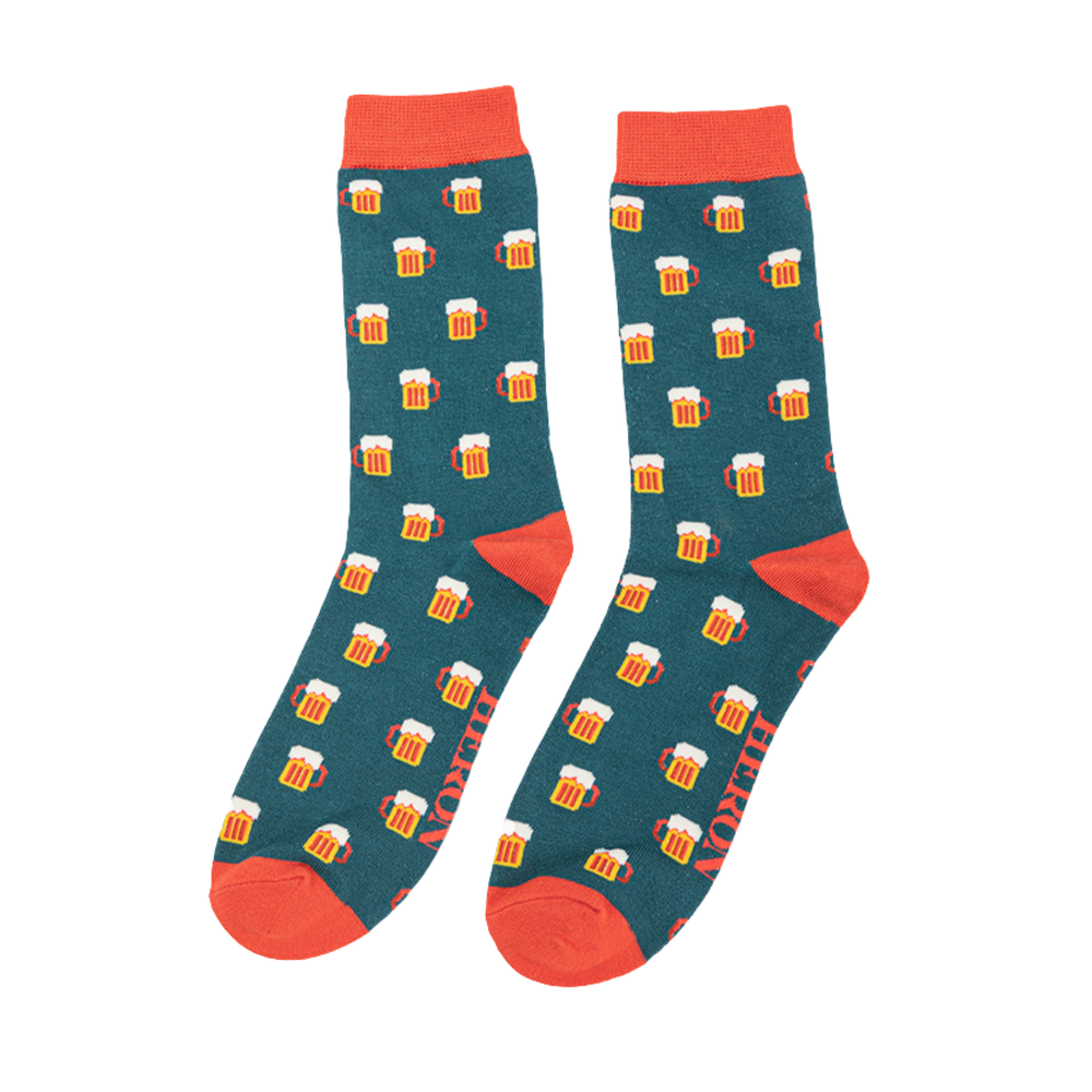 A pair of socks depicting pints of frothing beer. Green legs, orange toe, cuff and heel.