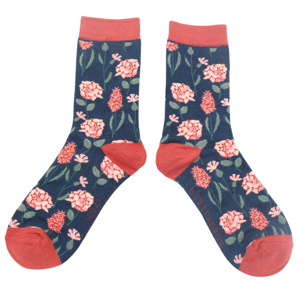 
                      
                        Botany Bamboo Socks - Miss Sparrow. A pair of socks depicting British flowers and plants. Dark blue legs, red heel, cuff and toe.
                      
                    