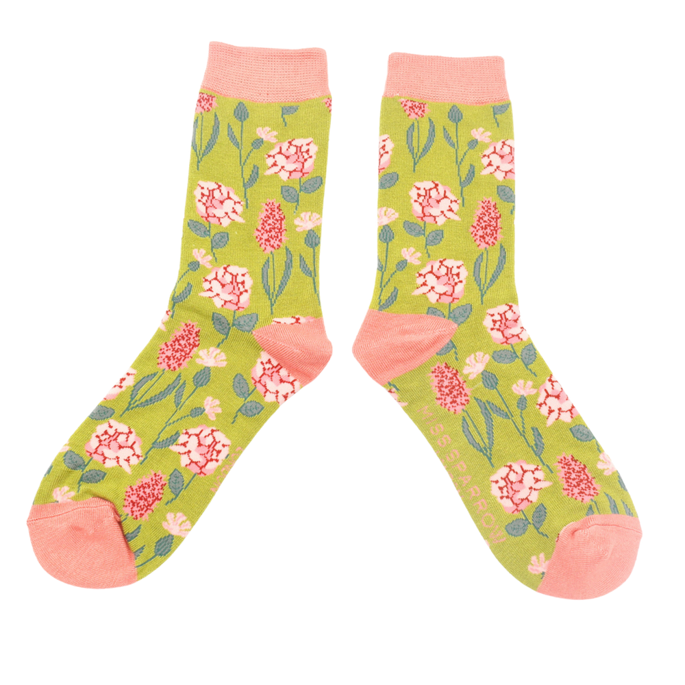 
                      
                        A pair of socks depicting British flowers and plants. Yellow legs, peach heel, cuff and toe.
                      
                    