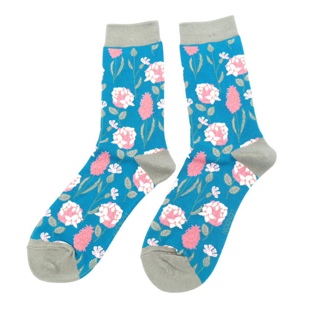 
                      
                        A pair of socks depicting British flowers and plants. Light blue legs, grey heel, cuff and toe.
                      
                    